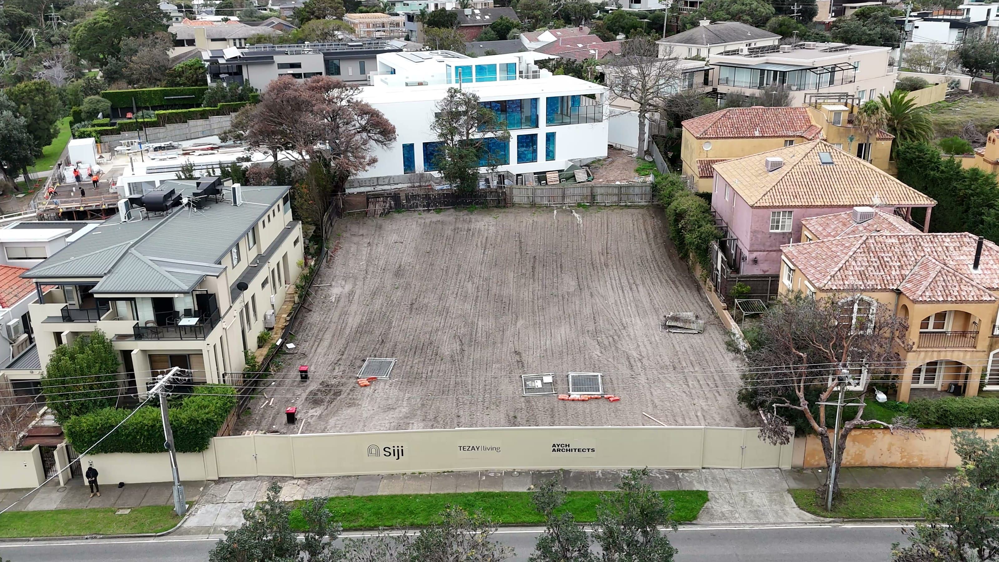 Aerial view of the cleared Beach Road site behind Siji hoarding, ready for basement construction
