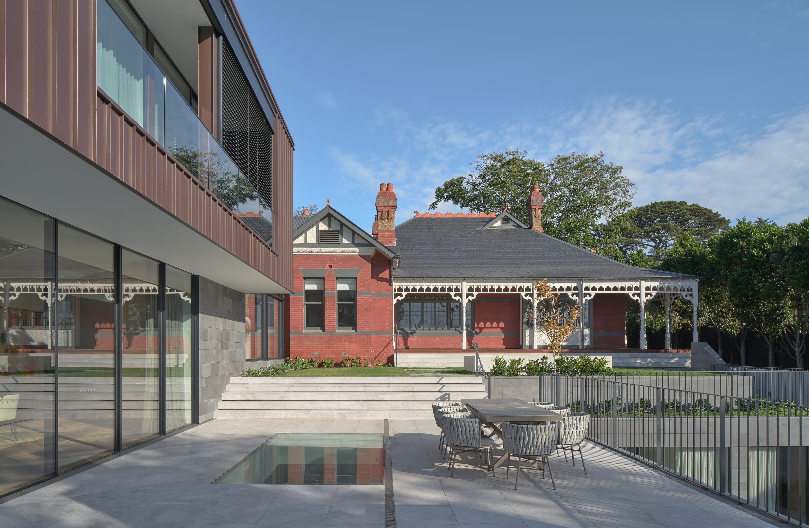The pool and restored house seen together from the rear garden