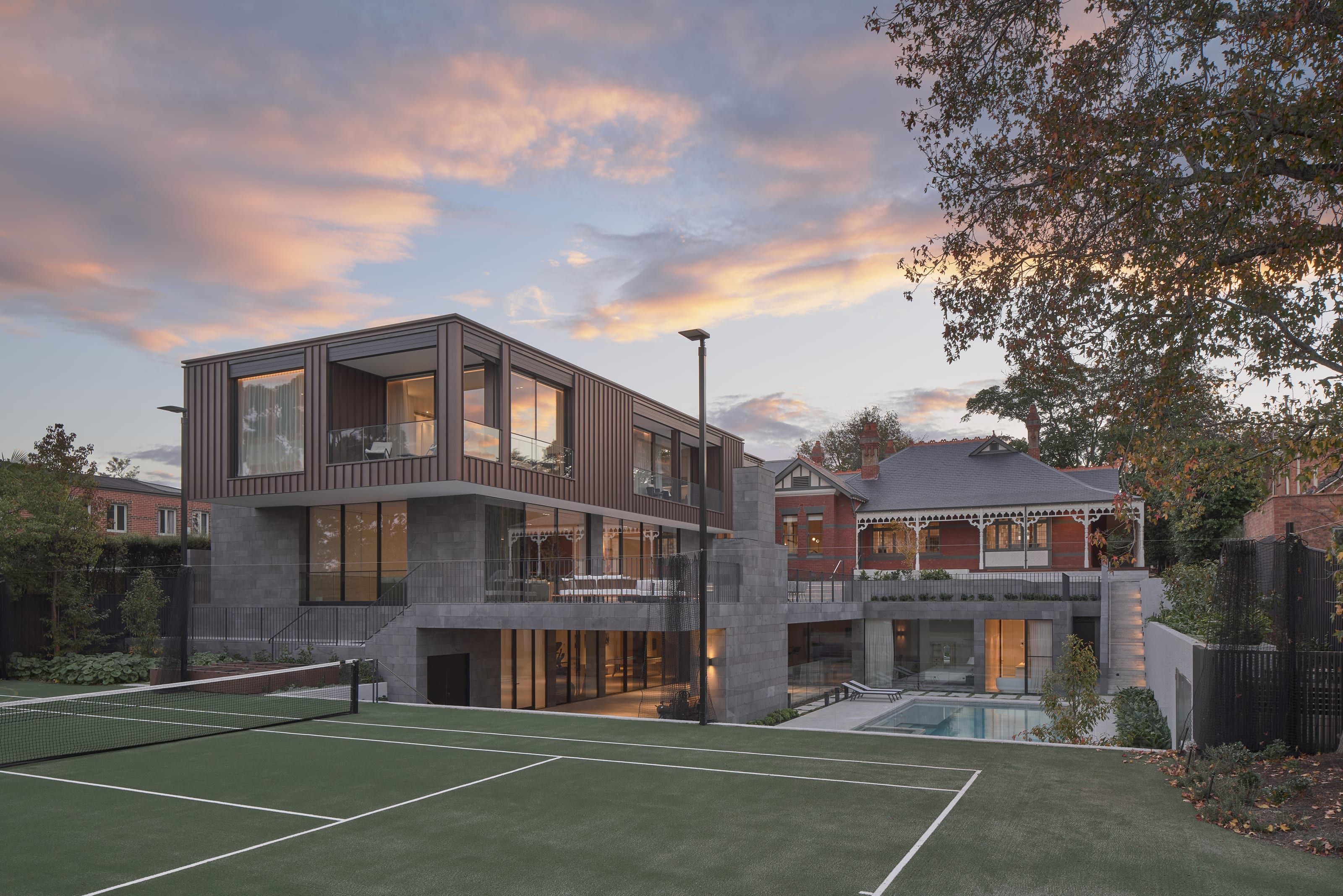 Cranston House at dusk: the restored heritage home and its contemporary extension
