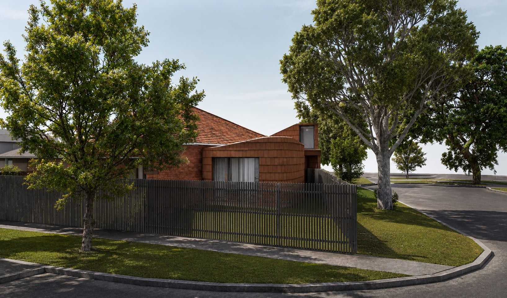 The corner of the site, with the curved shingle-clad addition beside the original red brick home